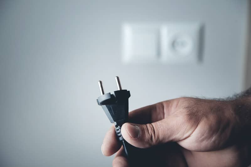 grab the router’s power cord and unplug it from the outlet